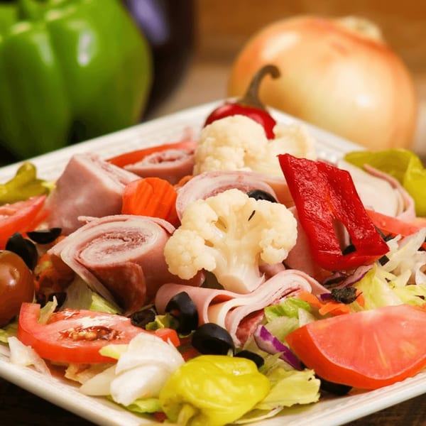 Ameci's antipasto salad with ham, salami, cheese, olives, tomatoes, and peppers.